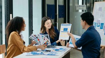 UX developer and ui designer brainstorming about mobile app interface wireframe design with customer breif and color code photo