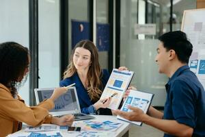 UX developer and ui designer brainstorming about mobile app interface wireframe design with customer breif and color code photo