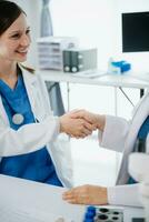 Caucasian doctor smiling take care of a young patient in hospital. Friendly nurse or therapeutic treat client Professional photo