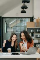 Business colleague business presents and explains and using laptop and tablet. Teamwork, financial marketing team, photo