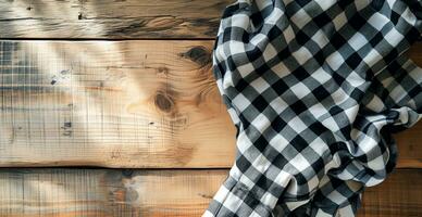 AI generated Top view of black checkered tablecloth on blank empty wooden table background banner, food concept photo