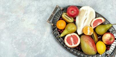 Delicious exotic fruits on a tray. photo