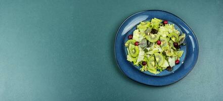 Kiwi salad in a plate photo