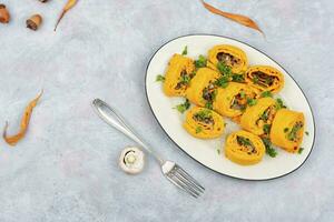 Pumpkin rolls with mushrooms photo