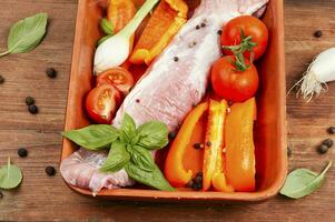 Raw pork tenderloin in a baking dish. photo