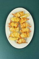 Grilled shrimp potato rolls. photo