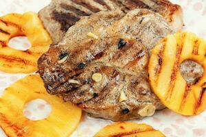 Grilled meat steak with ananas. photo