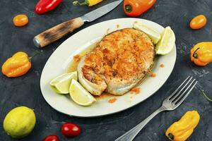 Grilled salmon steak in orange marinade. photo