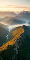 AI generated Aerial view of mountains in low clouds at sunrise in autumn. Top drone view of hills with red and orange trees in fog, colorful sky in fall. Slovenia. Nature. Mountain valley. photo