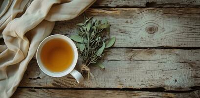 ai generado un taza de té y un haz de seco hojas en un de madera mesa foto