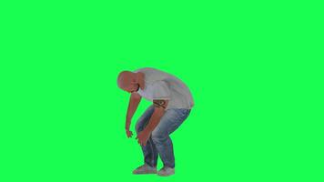 A man with a fat athletic body in a green screen with a dark white short-sleeved video