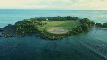 Aerial view of island with park and monument and evening tones in Bali video