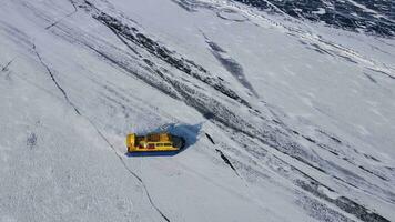 Hovercraft glides over Baikal's ice northern nature's marvel Hovercraft unusual mode transport ice. Hovercraft on lake facing snow frost extreme north Extreme travel exploring icy terrains. video