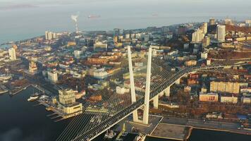 Beautiful autumn top view of cable-stayed bridge with hills at sunrise video