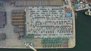 Parking of imported cars in the port, waiting for customs clearance. Drone view video