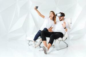 Couple having fun playing with virtual reality photo