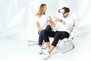 Couple having fun playing with virtual reality photo