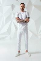 Handsome man wearing pants and white t-shirt photo