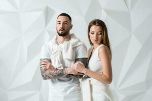 Fashionable couple posing at studio. photo