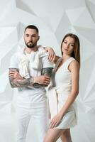 Fashionable couple posing at studio. photo