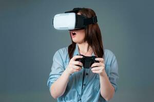 portrait of happy young beautiful girl getting experience using VR-headset glasses of virtual reality photo