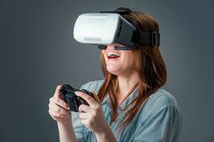 portrait of happy young beautiful girl getting experience using VR-headset glasses of virtual reality photo