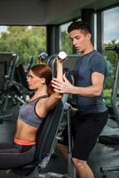 happy cutie athletic girl , execute exercise with dumb-bells photo