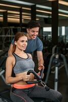 happy cutie athletic girl , execute exercise in sport-hall photo