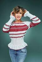 Portrait charming young lady with short wavy hair in embroidery. photo