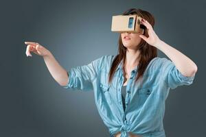 young woman using a VR headset glasses photo