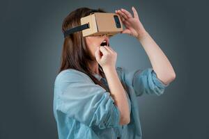 young woman using a VR headset glasses photo