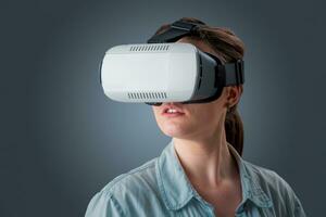 young woman using a VR headset glasses photo