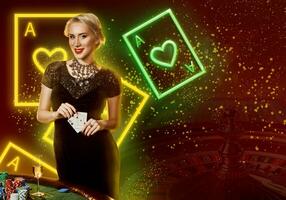 Girl in black dress showing aces, smiling, posing at table with chips, champagne. Colorful background with neon playing cards, roulette. Poker, casino photo