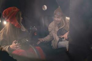 Emotional preteen girl talking to female friend in helicopter cockpit photo