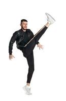 Full-length photo of a funny guy dancing in studio isolated on white background.