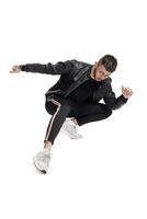 Full-length photo of a funny guy dancing in studio isolated on white background.