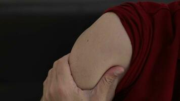 Hands massaging shoulders to relieve pain video