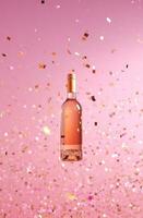 AI generated a bottle of wine is flying in the air on a pink background photo