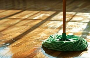 AI generated clean floor on a wooden floor with green mop photo