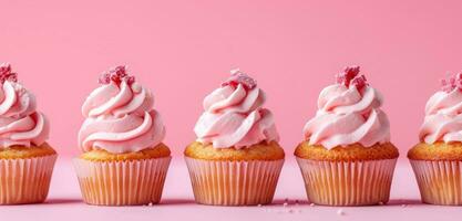 AI generated a row of pink cupcakes on a pink background photo