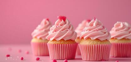 AI generated pink cupcakes on the table on pink background photo