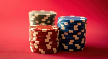 AI generated stacked up poker chips on surface of red background photo
