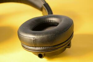 Close up black headphone, headphone part close up photo