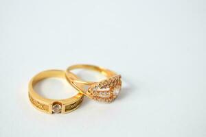 Close Up Golden ring with diamond on isolated white background photo