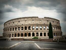 Gray clouds over Colosseum photo