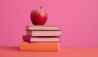AI generated apple on a stack of books education photo