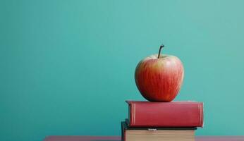 ai generado un manzana en parte superior de un apilar de libros con azul cielo foto