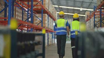 operation workers checking and inspecting cargo for stack items for shipping. Supervisor and staff working in factory warehouse discuss about parts inventory. Worker Scanning Package In Warehouse. video