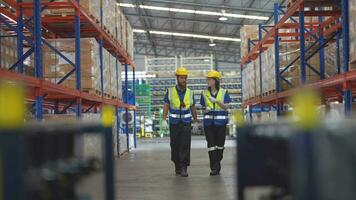 operation workers checking and inspecting cargo for stack items for shipping. Supervisor and staff working in factory warehouse discuss about parts inventory. Worker Scanning Package In Warehouse. video