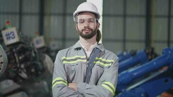 Factory man engineer inspecting on machine with smart tablet. Worker works at heavy machine robot arm. Artificial intelligence concept. specialist Worker working at height technology industry. video